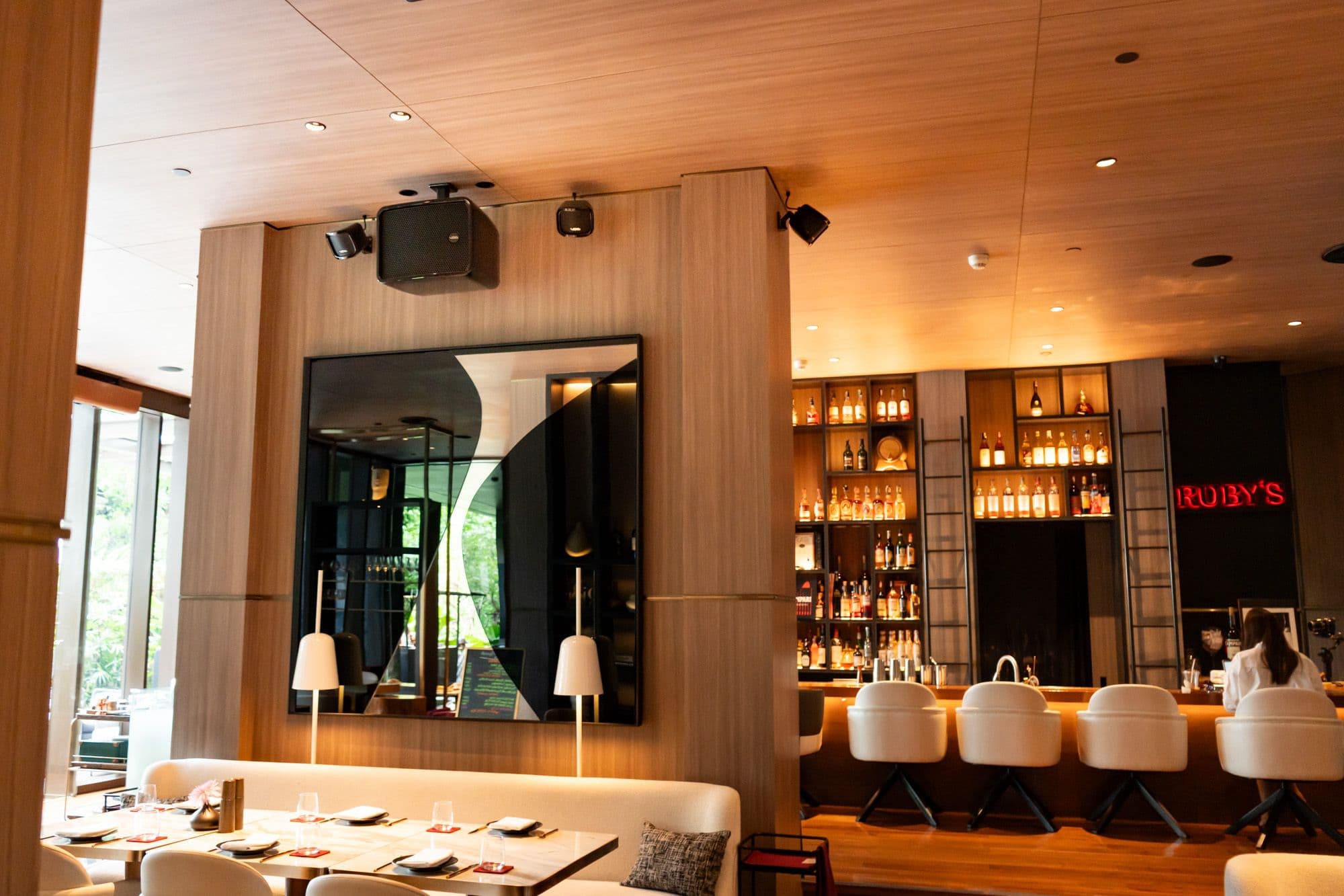 Nestled within the stylish Kimpton Maa-Lai Bangkok Hotel, Ms. Jigger is a sophisticated Italian restaurant that blends warm interiors with a vibrant, dynamic atmosphere. To complement its culinary excellence, the venue required a sound system capable of delivering consistent high-fidelity audio that could support both lively lunch to dinner service and intimate conversation. Aura Visual System, in collaboration with Never2Late, answered this brief with a precision-engineered Void Acoustics installation.